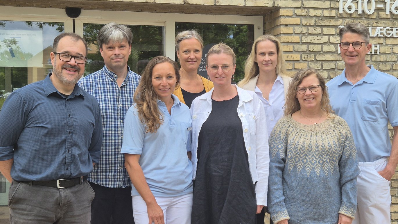 Photo showing the entire research group outside the department